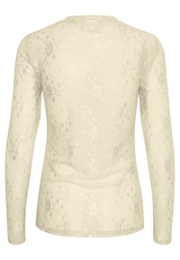 Helles beige Langarmoberteil mit Blumenmuster, glatter Textur, rundem Ausschnitt und taillierter Passform. Wurde mit zarten, subtilen Details versehen.