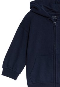 Marinblå zip-up hoodie med en stor huva, elastiska ärmslut och framfickor. Tillverkad av mjukt tyg med en slät yta.