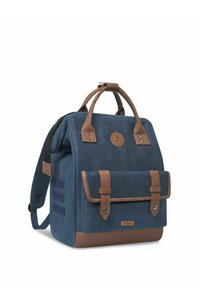 Navy canvas backpack with brown leather accents, double top handles, front flap pocket, and adjustable shoulder straps.
