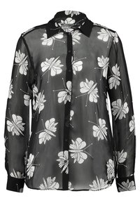 Blusa nera trasparente con stampa floreale bianca, con bottoni sul davanti e maniche lunghe. Presenta un colletto e polsini neri, dalla texture leggera.