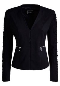 Blazer noir au design ajusté, avec des manches froncées, un décolleté en V et des poches zippées argentées à l'avant. Texture de tissu lisse.