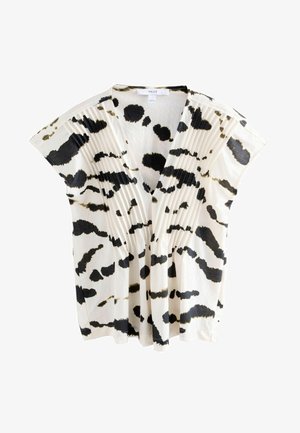 Blusa a maniche corte color crema con un motivo astratto nero. Presenta un profondo scollo a V e pieghe sulla parte anteriore, realizzata in tessuto leggero.