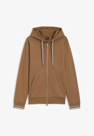 Brun zip-up hoodie med en stor hætte, to frontlommer og stribede manchetter. Har kontrasterende snøre og en blød, glat tekstur.