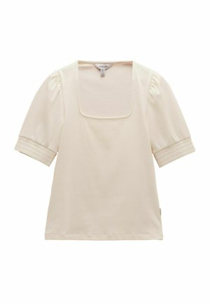 Kremowa bluzka z krótkim rękawem, kwadratowym dekoltem i marszczonymi mankietami na rękawach, ułożona na płasko na białym tle.