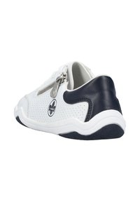 White sneaker with perforated upper, navy leather accents, side zipper, and textured rubber sole, featuring a logo on the outer side.
