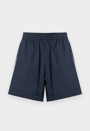 Temno modre športne kratke hlače z elastičnim pasom. Bele stranske črte, lahka tkanina in ohlapen kroj z ravnimi hlačnicami.