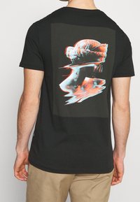 YOURTURN Printtipaita - black