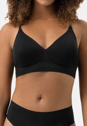 Seno senza cuciture nero con design a V, spalline regolabili, tessuto morbido e senza hardware visibile. Texture liscia con un aspetto minimalista.
