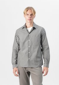 Striped long-sleeve shirt in grey with white vertical lines, a classic collar, button front, and a single chest pocket. Smooth fabric texture.