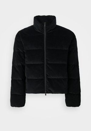 Black corduroy puffer jacket with a high collar and a front zipper. Features quilted sections for insulation and long sleeves.