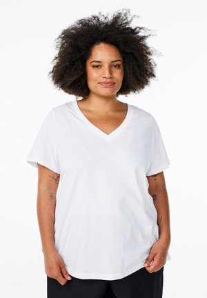 White cotton V-neck t-shirt with short sleeves, relaxed fit, and smooth texture. Visible tattoo detail on the left arm.