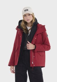 Aigle Krátky kabát - deep red