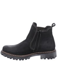 Botines de ante negro con cierre de cremallera, suela de goma, costuras blancas en contraste y parte superior texturizada. Cuenta con una pestaña en el talón para facilitar su uso.
