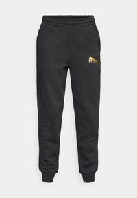 Sorte bomullssweatpants med elastisk midje, ribbestrikkede ankler og en gyllen Puma-logo på venstre lår. Enkelt design med avslappet passform.