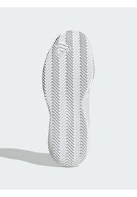 Semelle de sneaker blanche avec un motif en chevron, présentant des accents texturés et un logo près du talon. Fini lisse et forme arrondie.
