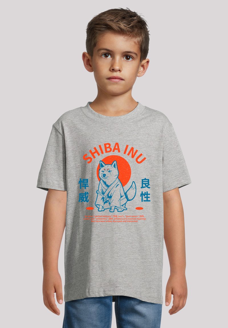 Gray short-sleeve t-shirt featuring a blue Shiba Inu graphic with red accents and Japanese text. Cotton material, relaxed fit.