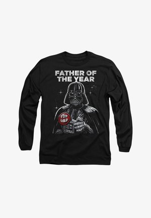 Black long-sleeve shirt featuring a graphic of a masked character, text "FATHER OF THE YEAR," and "TOP DAD" badge in red and white.
