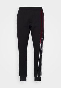 LARGE FLAG - Tracksuit bottoms - black