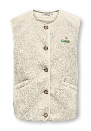 Veste sans manches en polaire couleur crème avec col rond, cinq boutons marron, deux poches avant et un petit écusson multicolore sur la poitrine.