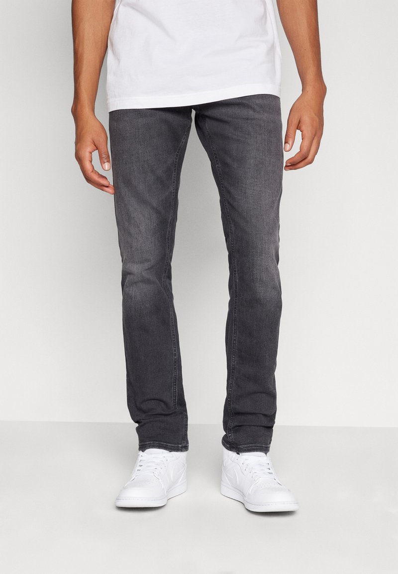 Tommy Jeans SCANTON SLIM - Prigludę džinsai - denim black