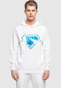 Biely mikina s kapucňou so modrou diamantovou grafikou a textom "TAKE ME HOME". Materiál vyzerá mäkko; na prednej strane je klokaní vrecko.