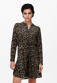 Schwarzes Kleid mit einem beige- und braunfarbenen abstrakten Muster, langen Ärmeln, einem V-Ausschnitt und einem Kordelzugbund für eine verstellbare Passform.