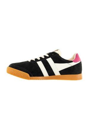 Black suede sneaker with white side stripes, gum sole, white laces, and pink heel tab, shown in profile view.