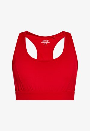 Červená športová podprsenka vyrobená z hladkej, elastickej tkaniny. Má výstrih so zaobleným okrajom, široké ramienka a zberný detail na páse. Veľkosť XS/S.