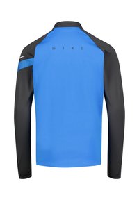 Blue and black long-sleeve Nike athletic top with a high collar, smooth texture, and logo detail on the back. Raglan sleeves for mobility.
