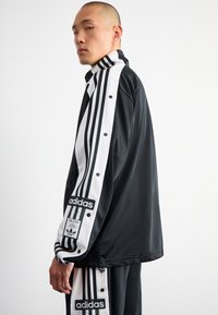 adidas Originals MEGABREAK - Training jacket - black
