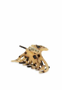 Clip per capelli in tartaruga con una finitura lucida. Dotato di denti allungati e flessibili e di un attacco trasparente per una tenuta sicura.