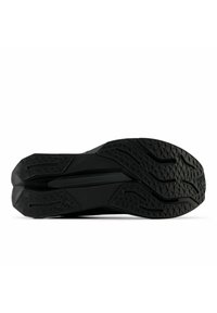 Black athletic shoe sole with textured rubber pattern, featuring angular grooves and a smooth central section. Tread designed for traction.