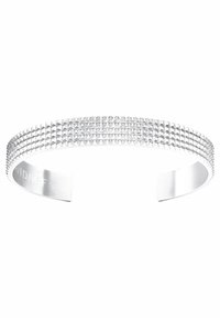 Silver cuff bracelet featuring a textured surface with small pyramid-shaped accents, smooth edges, and an engraved logo.