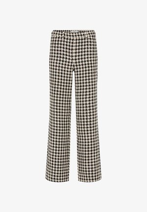 Zwarte en crèmekleurige broek met een houndstooth-patroon, met een wijde pijp en een elastische tailleband; de stof lijkt textuur te hebben en is lichtgewicht.
