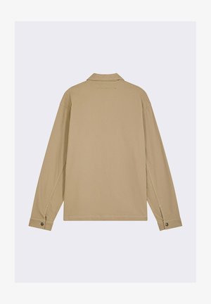 Beige longsleeve shirt met kraag, zichtbare stiksels en knoopmanchetten. Heeft een relaxte pasvorm en een logo detail op de achterkant. Glad materiaal.