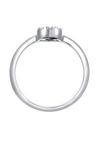 Silberring mit einem glatten Band und einem Kleeblatt-Design an der Oberseite, das drei erhöhte Abschnitte für ein strukturiertes Detail aufweist.