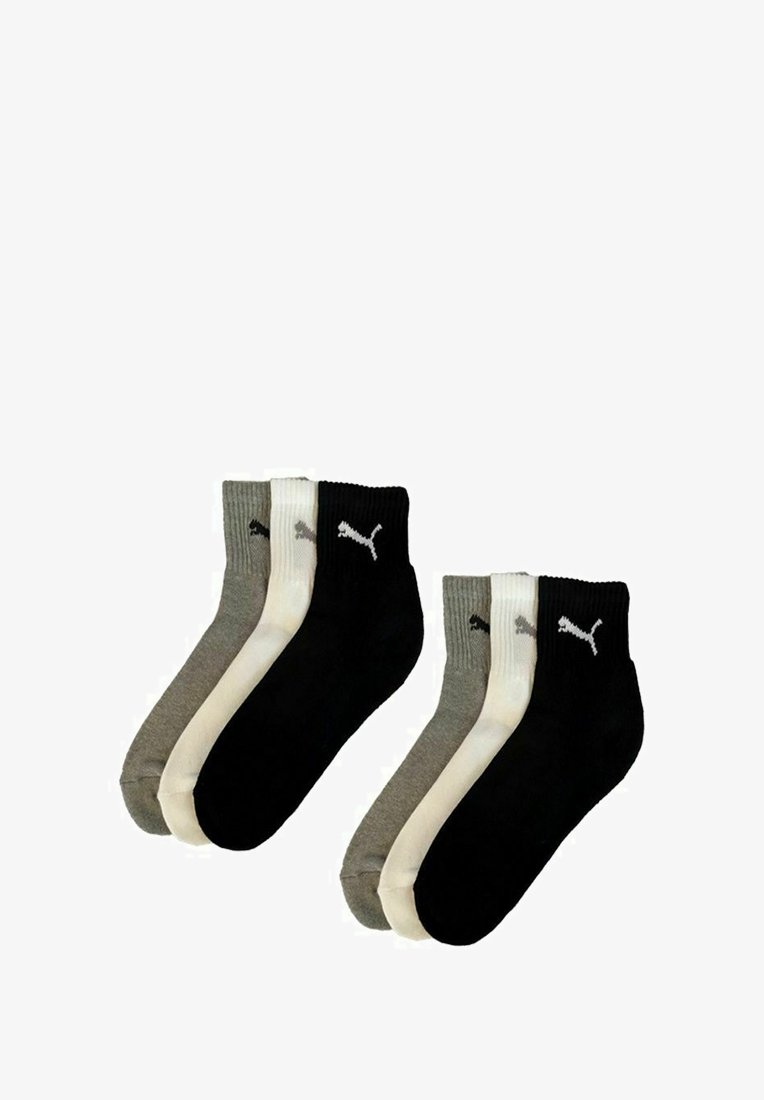 Two pairs of ankle-length socks in black and gray, made of cotton, featuring ribbed texture and a white Puma logo on each sock.