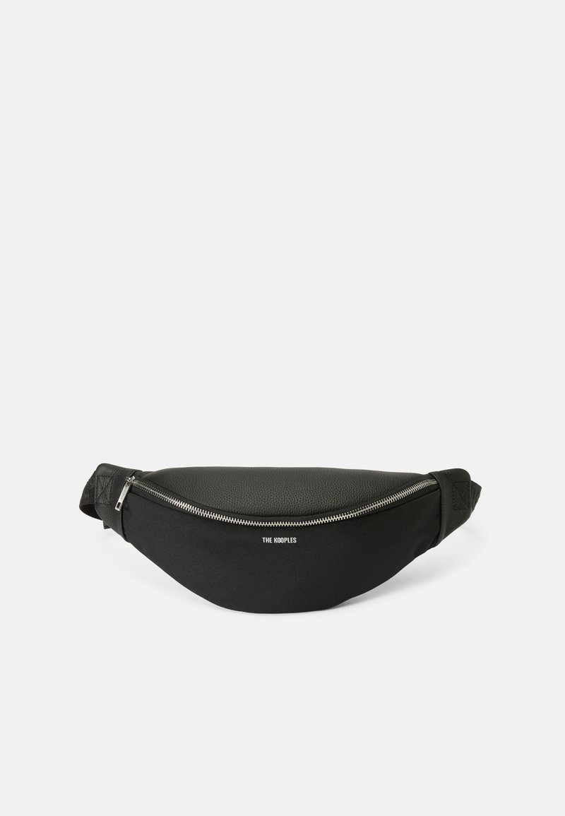 Black fanny pack with a curved design, featuring a textured leather front and smooth fabric back, silver zipper, and logo detailing.