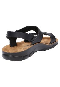 Schwarze Sandale aus synthetischem Material mit Korkfußbett, verstellbaren Riemen, Gummisohle und gepolstertem Design.