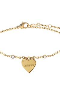 Gouden kettingarmband met een hartbedel waarin "GUESS" is gegraveerd, accenten van kleine heldere stenen. Veerhaaksluiting voor een veilige sluiting.
