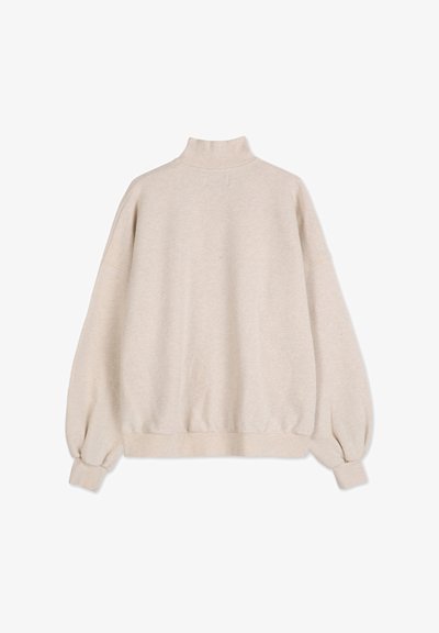Maglione beige con collo alto, spalle scese e polsini ed orlo elasticizzati. Realizzato in tessuto morbido e testurizzato.