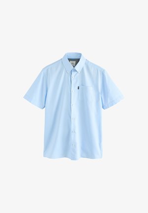 Helehallikas lühikeste varrukatega nööbitav puuvillane särk, millel on rinnatasku ja valge nööpide rida. Sile tekstuur, klassikalise krae disain.