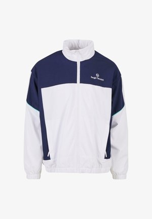 Witte en marineblauwe windjack met hoge kraag, volle voorrits, elastische manchetten en zijzakken. Bevat het merkelogo op de borst.