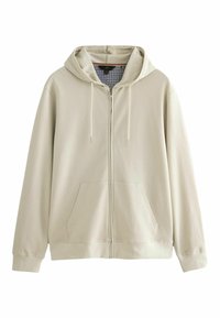 Světlé béžové mikina na zip s texturovaným povrchem, nastavitelnou kapucí se šňůrkou a dvěma předními kapsami. Jemná vzorovaná podšívka viditelná uvnitř.