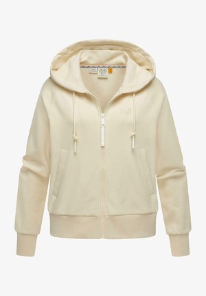 Haut de survêtement zippé beige clair en tissu doux. Il possède une capuche avec cordon de serrage, des poches avant, des poignets côtelés et un logo en relief subtil.