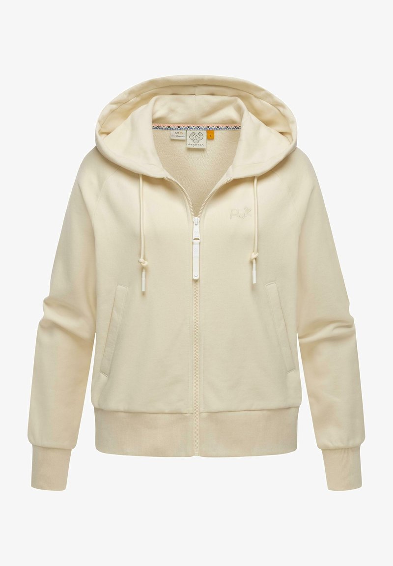 Sudadera con cremallera de color beige claro, hecha de una tela suave. Presenta una capucha con cordón, bolsillos frontales, puños acanalados y un sutil logo en relieve.