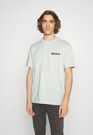DRANDO - T-shirt con stampa - light/pastel green
