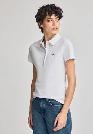 White polo shirt made from a smooth fabric, featuring a three-button placket and a small black embroidered logo on the left chest.