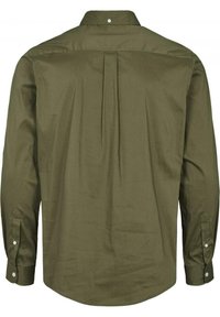 Långärmad olivgrön skjorta med knäppbar krage, detalj med veck bak och knappade ärmslut. Slät tygstruktur.