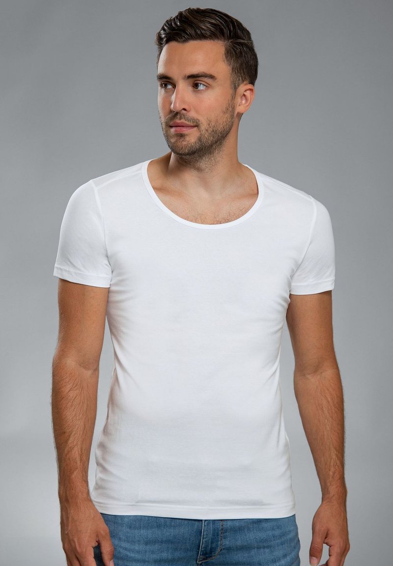 Witte korte mouwen t-shirt met een ronde hals, gemaakt van gladde katoenstof. Slim fit, met minimale naden en een strak ontwerp.